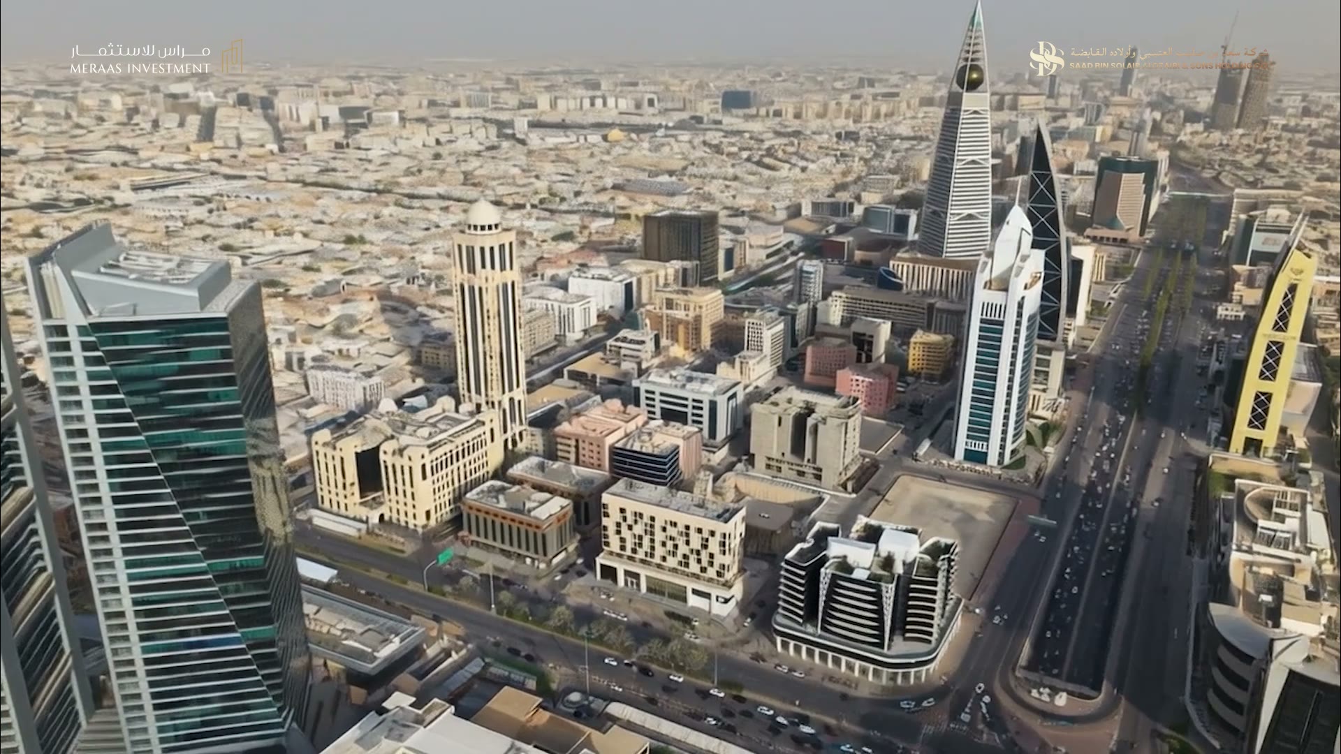 Opening frame of the SBS Business Tower film — Al-Olaya from the air, Al Faisaliah Tower at the centre of the skyline.